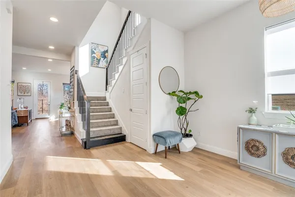 a view of a livingroom with furniture and staircase