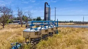 a view of a lake with chairs