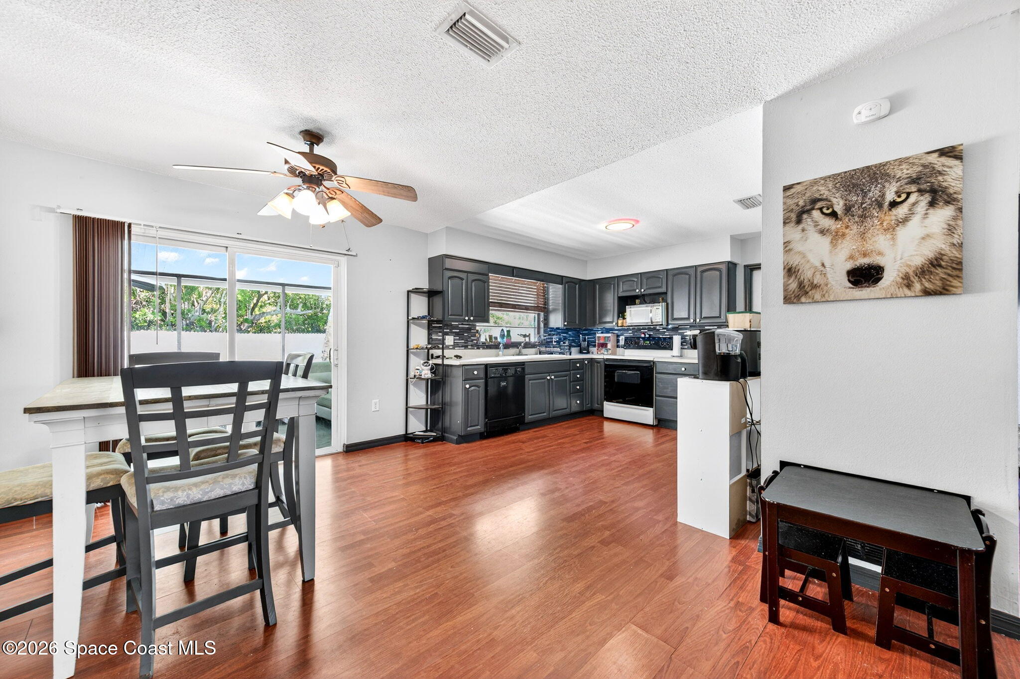 3300 Argyle Road Titusville, FL 32796 - Photo 12 of 29 a view of kitchen with dining table and chairs