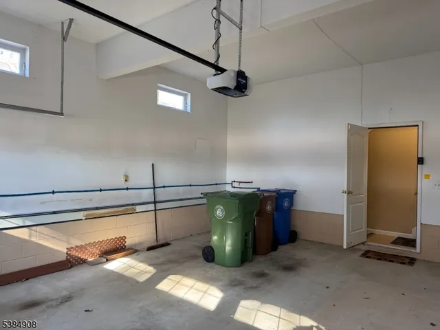 a kitchen with a refrigerator and window