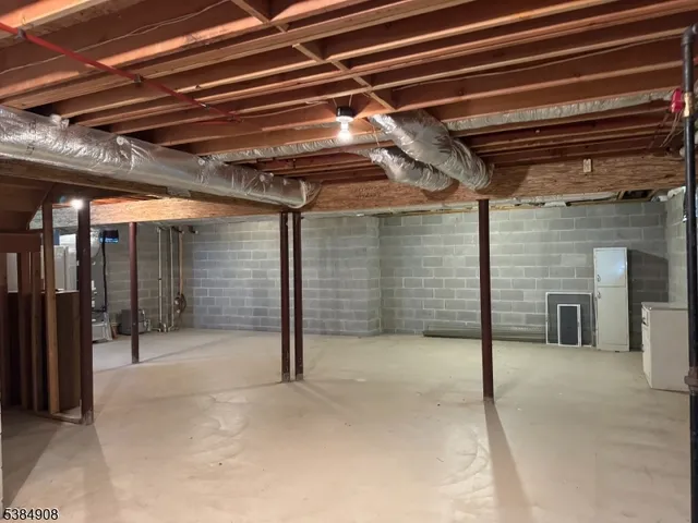 a view of empty room with wooden ceiling