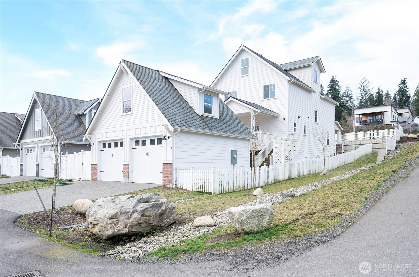 a front view of a house with a yard