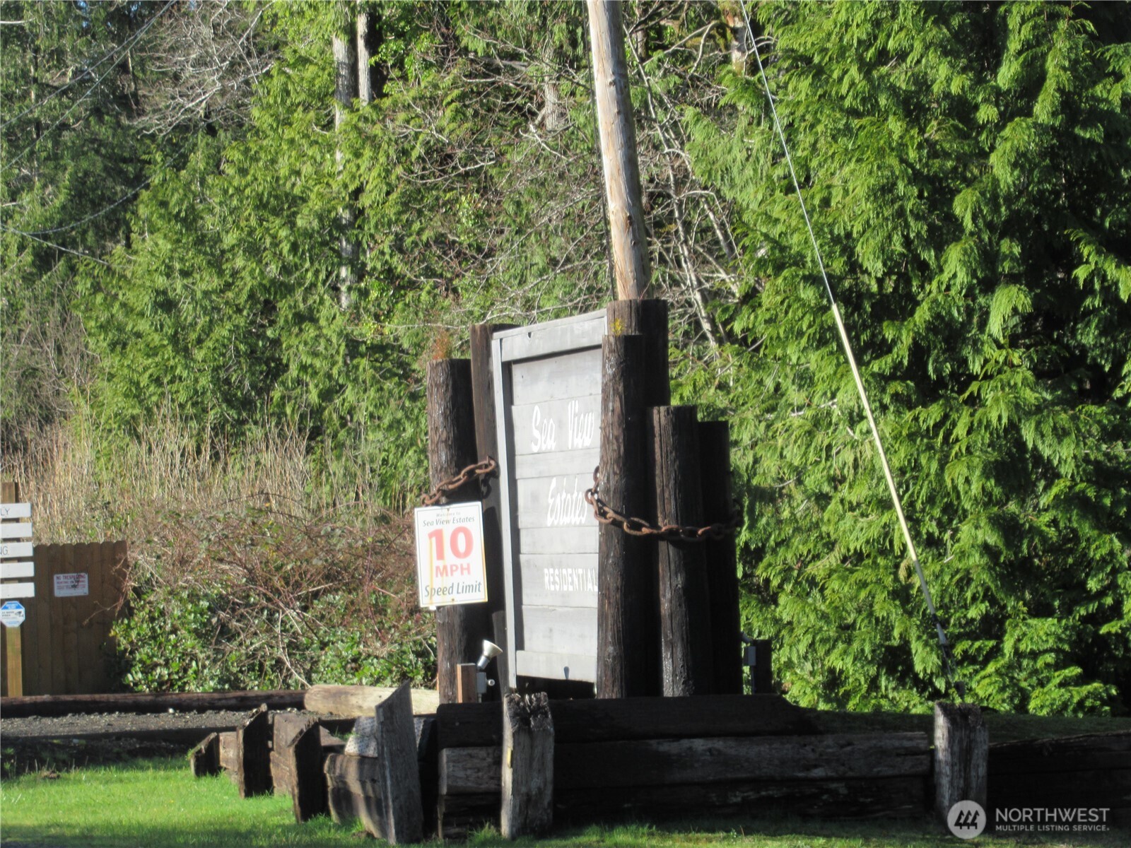107 Dolphin Street Copalis Beach, WA 98535 - Photo 2 of 6 an outdoor space with seating area and trees