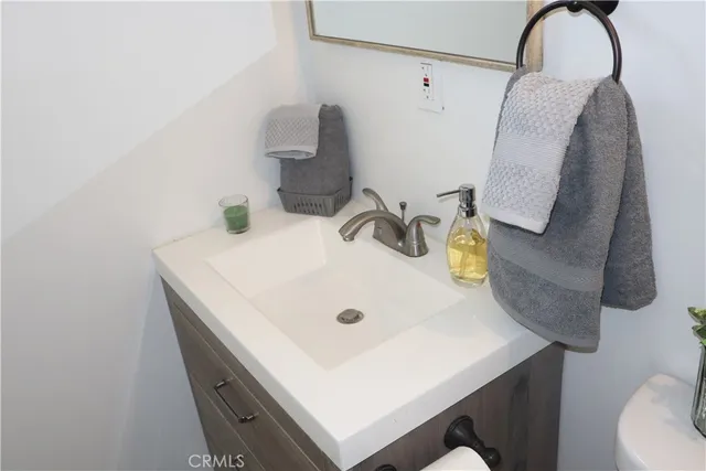 a bathroom with a sink and mirror