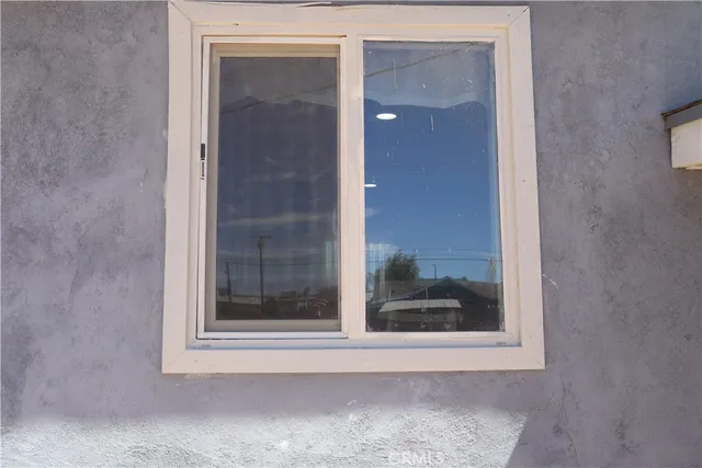 a view of a bathroom that has a glass door and shower