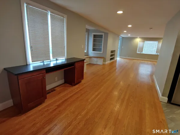a view of kitchen and wooden floor