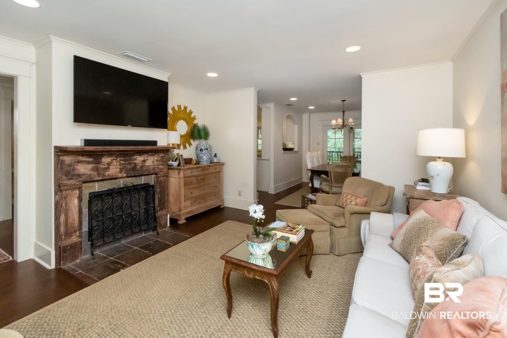 4810 Mums Court Mobile, AL 36608 - Photo 9 of 50 Living room featuring wood finished floors, recessed lighting, a chandelier, a fireplace, and crown molding