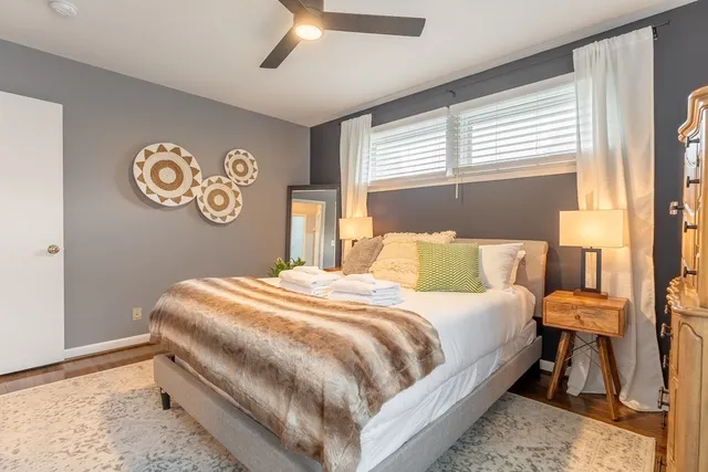 a bedroom with a bed and a window