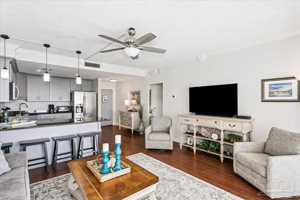 a living room with furniture and a flat screen tv