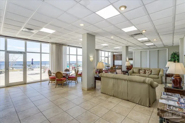 a dining room with furniture mountain view and a chandelier