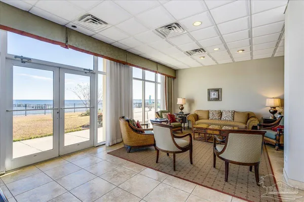 a lobby with furniture and a chandelier