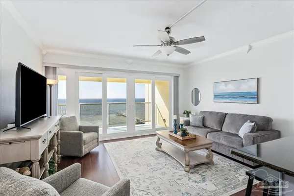 a living room with furniture and a flat screen tv
