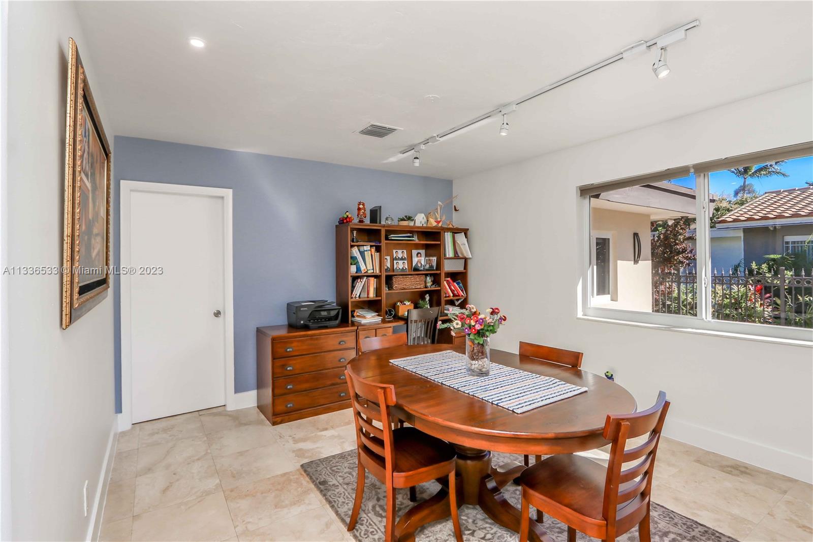 735 Tyler Street Hollywood, FL 33019 - Photo 23 of 35 a view of a dining room with furniture and window