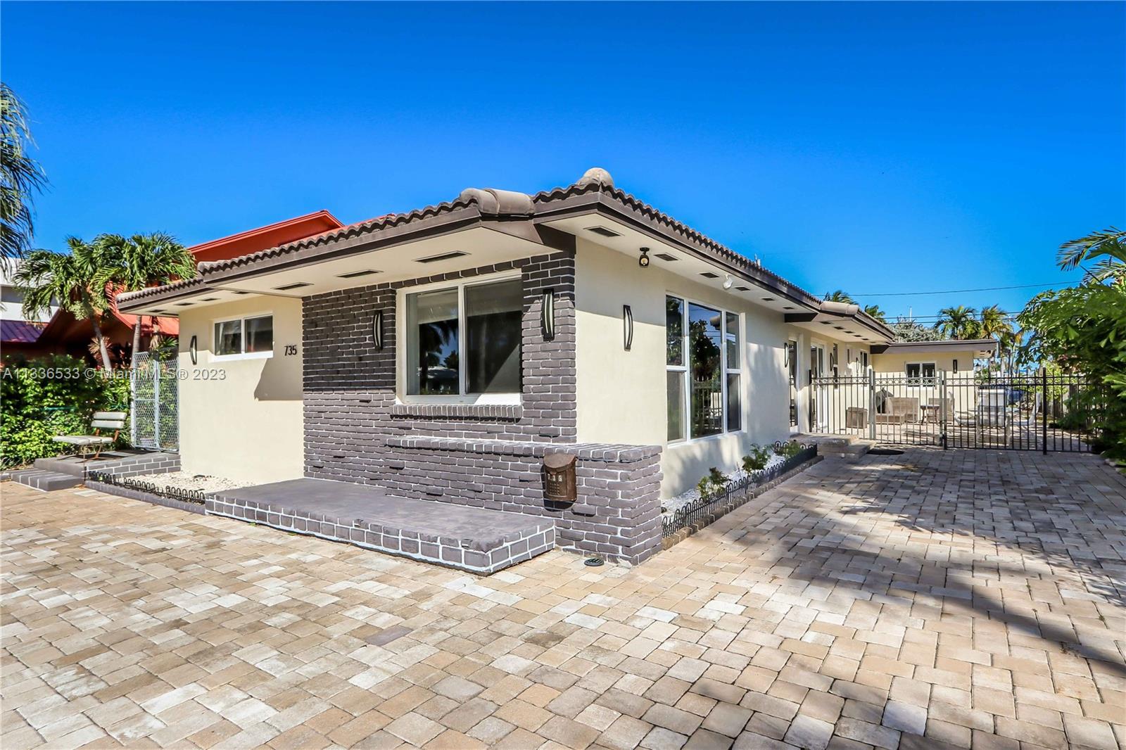735 Tyler Street Hollywood, FL 33019 - Photo 9 of 35 a view of a house with a patio