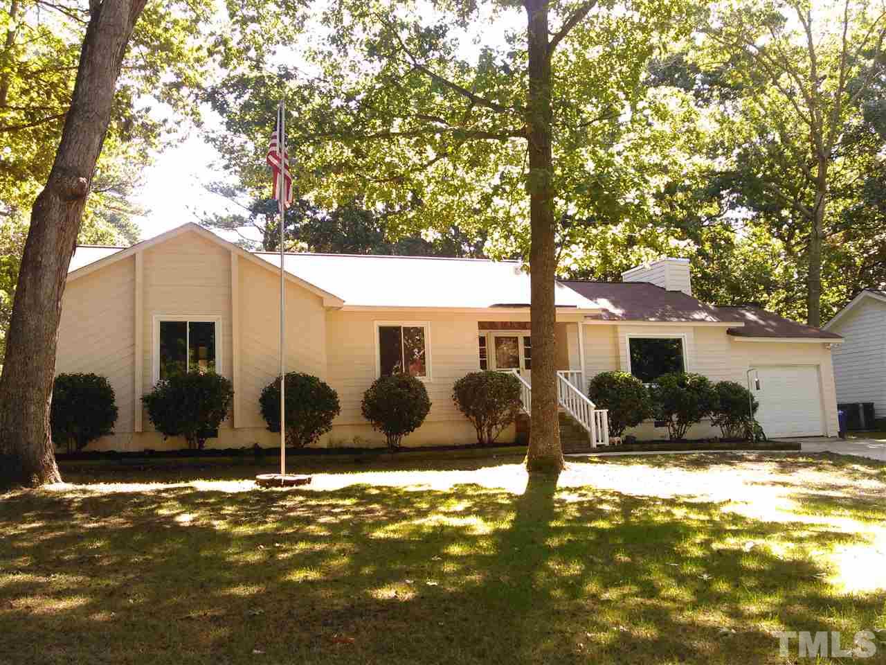 7508 Ray Road Raleigh, NC 27613 - Photo 1 of 18 a view of a large tree in front of a house