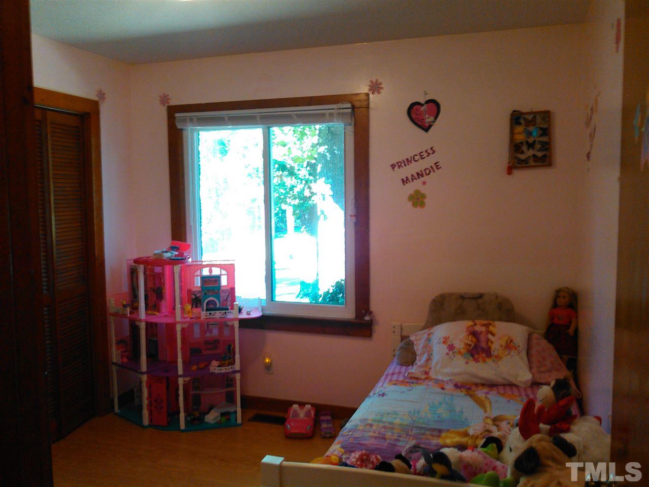 7508 Ray Road Raleigh, NC 27613 - Photo 12 of 18 a room with furniture and a window