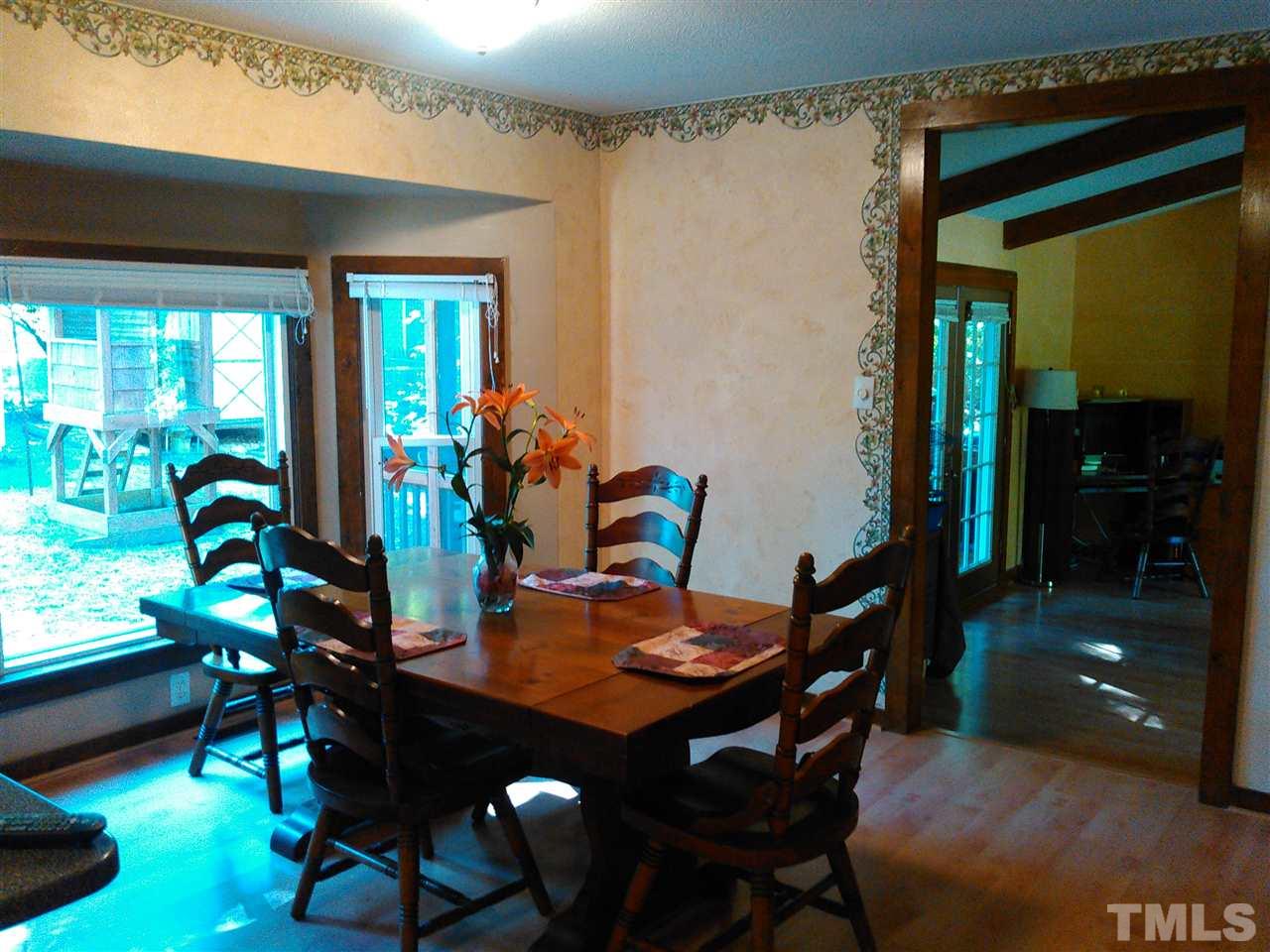 7508 Ray Road Raleigh, NC 27613 - Photo 5 of 18 a view of a dining room with furniture and window