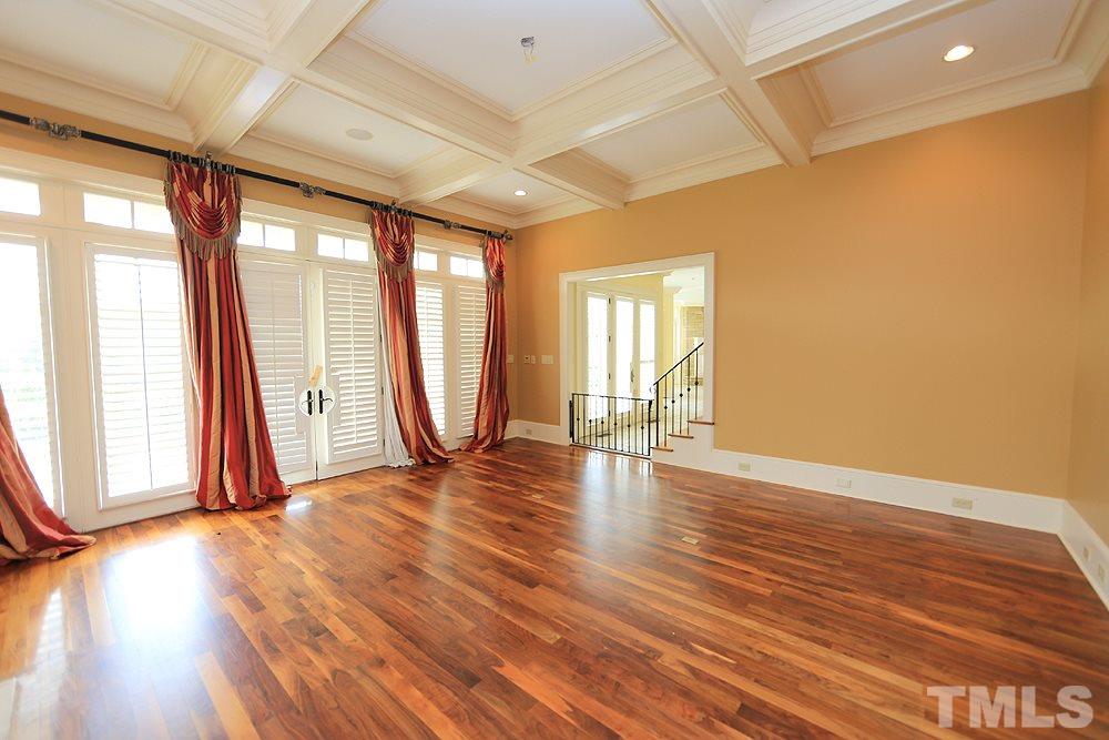 915 Ennis Road Angier, NC 27501 - Photo 8 of 30 A wall of french doors overlooks pool & patio, balcony views oversee the back paddocks. Adjoins the enormous kitchen for ease of entertaining. There's a butlers pantry, a formal dining and formal living room in the front of the homee