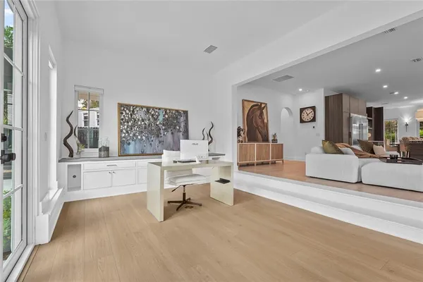 a view of room with wooden floor and cabinet
