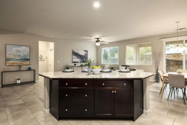 a spacious bathroom with a double vanity sink and a large mirror