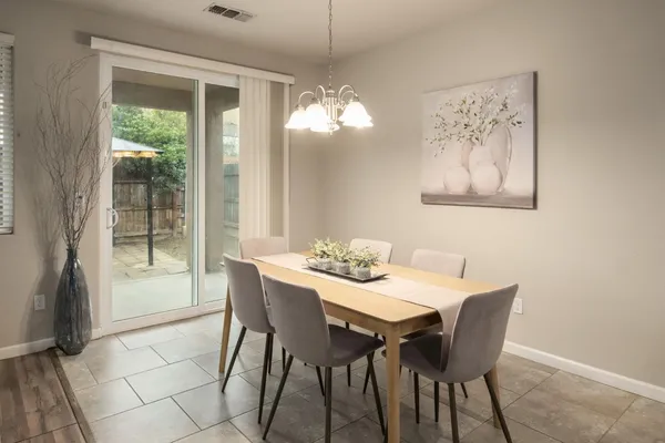 a view of a dining room with furniture window and outside view