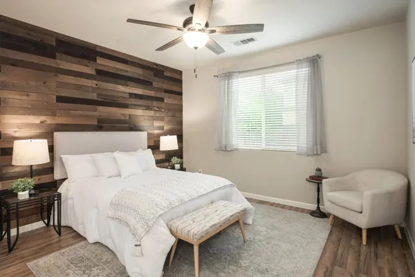 a bedroom with a bed and a couch