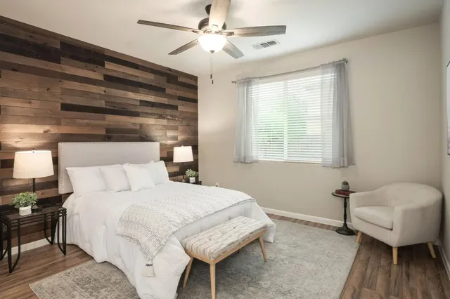 a bedroom with a bed and a couch