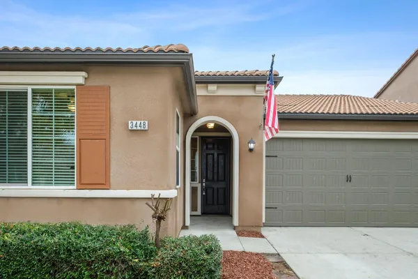 a front view of a house with a garage