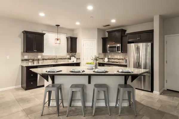 a kitchen with cabinets and counter space