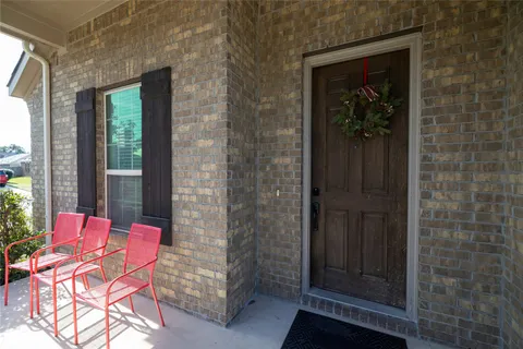 a outdoor room with chairs