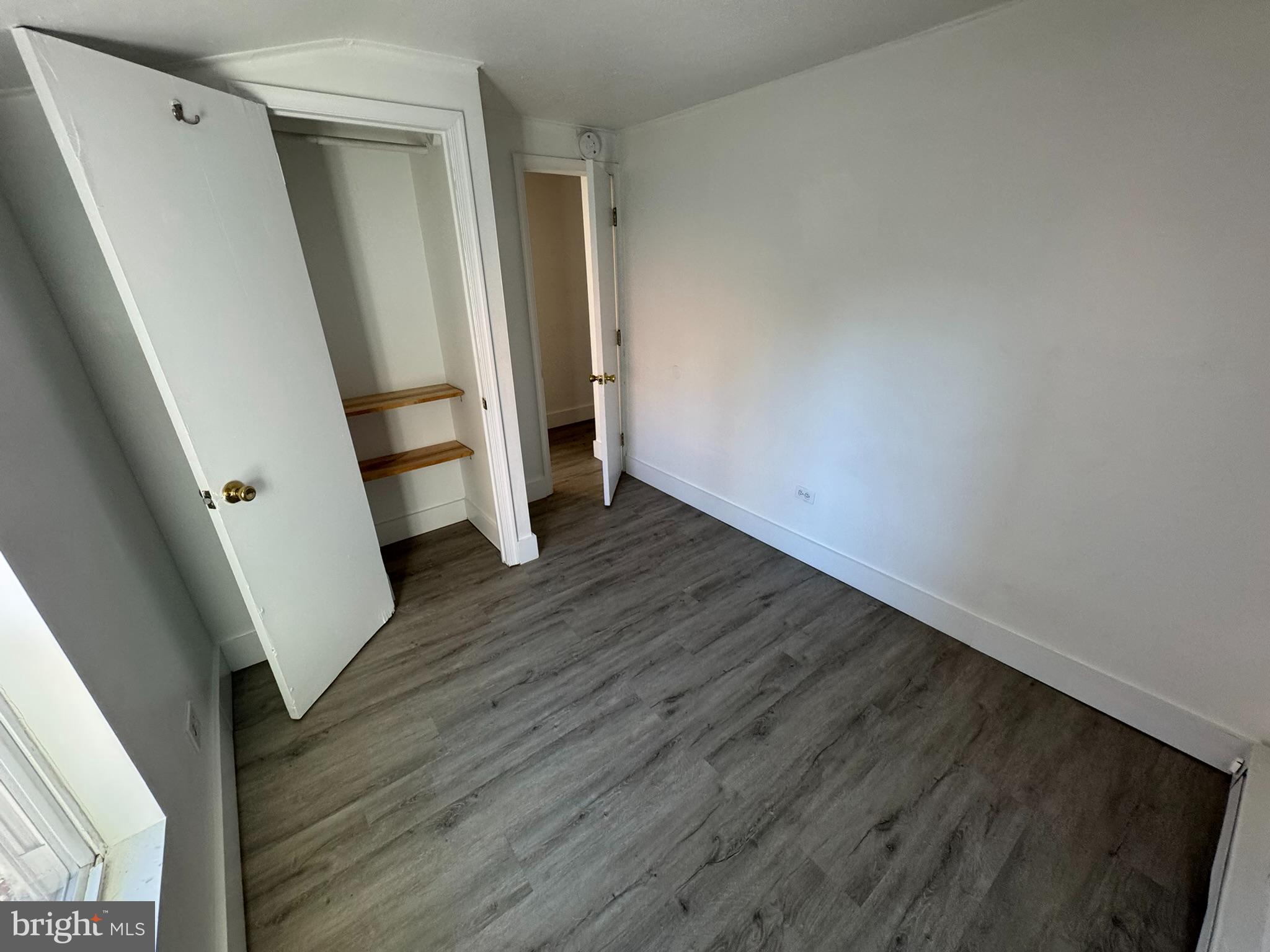 1600-2 Pine Street, Unit 3A Philadelphia, PA 19103 - Photo 8 of 10 an empty room with wooden floor and entrance