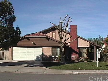 6531 Farmington Drive Riverside, CA 92504 - Photo 1 of 1 a front view of a house with a yard and garage