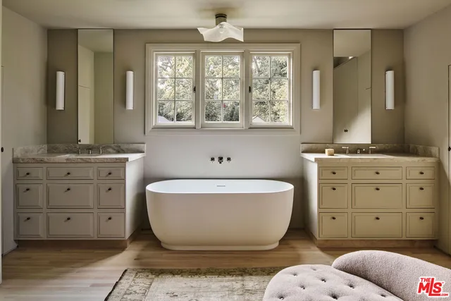 a spacious bathroom with a bathtub and a window