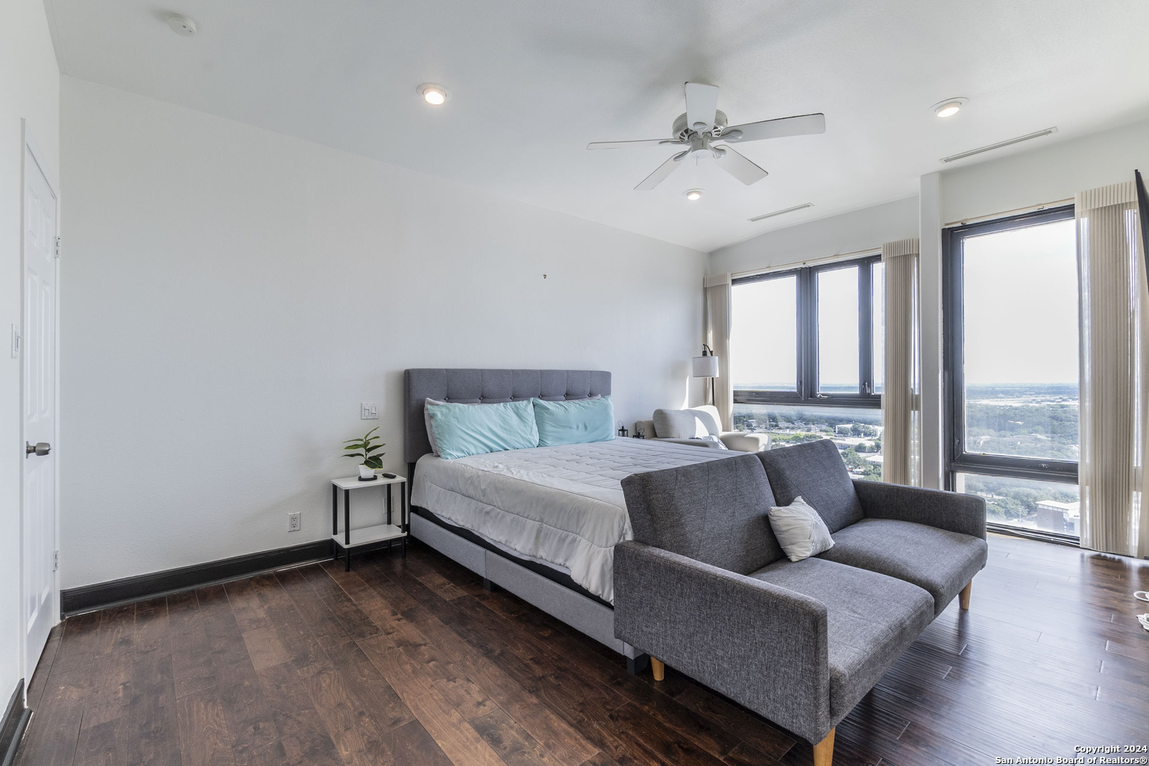 7701 Wurzbach Road, Unit 2302 San Antonio, TX 78229 - Photo 22 of 40 a bed room with a bed and a large window