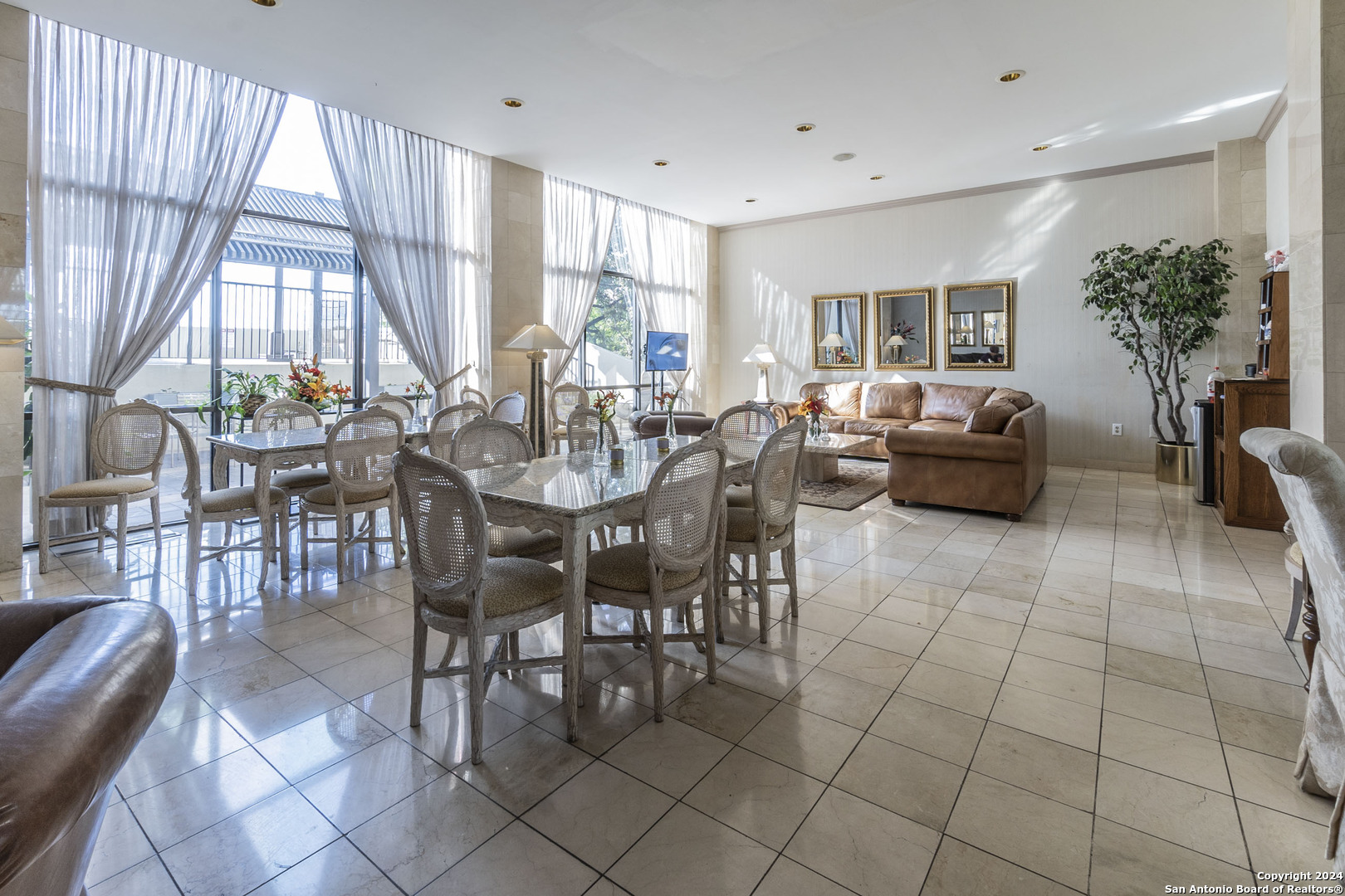7701 Wurzbach Road, Unit 2302 San Antonio, TX 78229 - Photo 31 of 40 a view of a dining room with furniture window and outside view