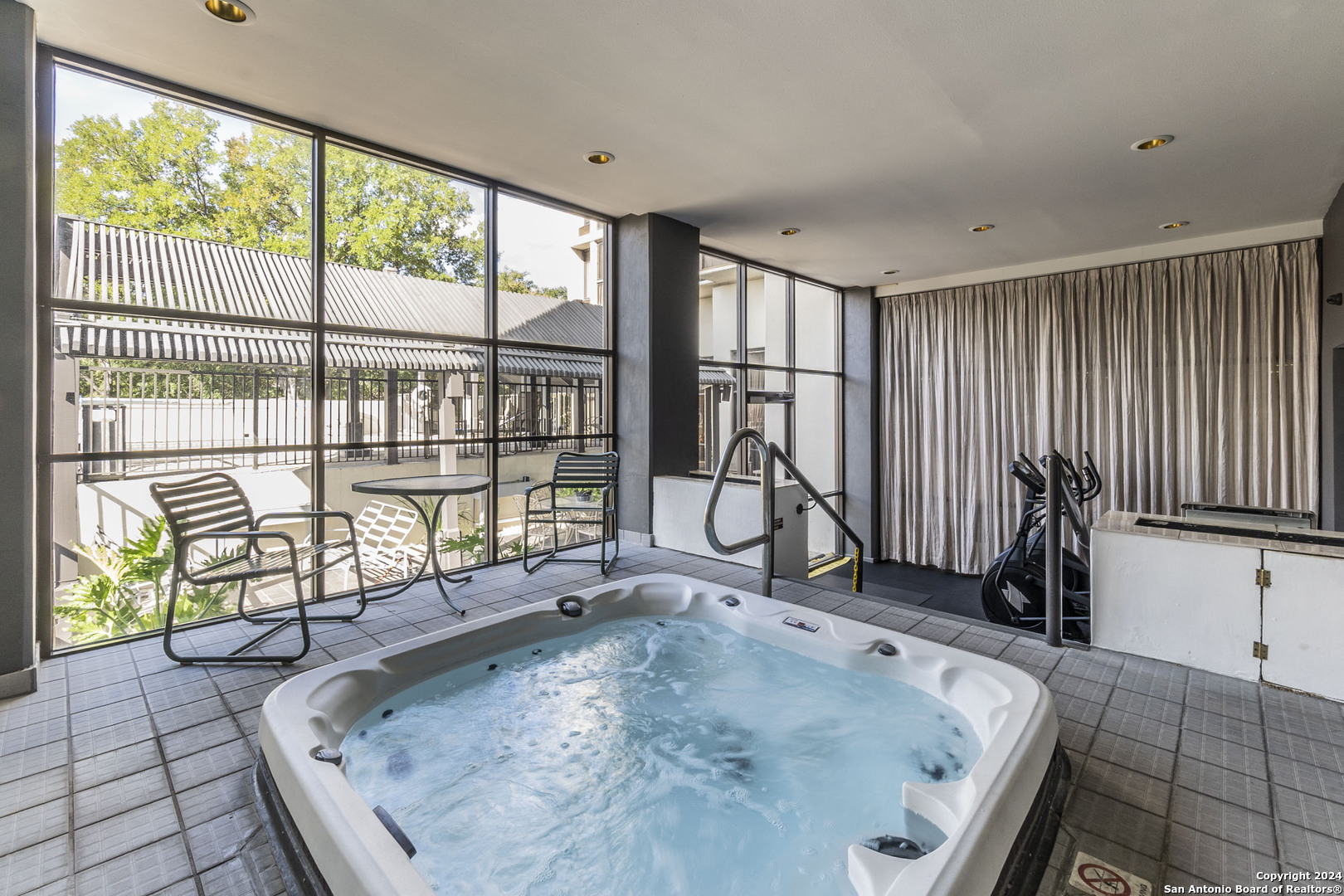7701 Wurzbach Road, Unit 2302 San Antonio, TX 78229 - Photo 35 of 40 a view of a living room and a floor to ceiling window