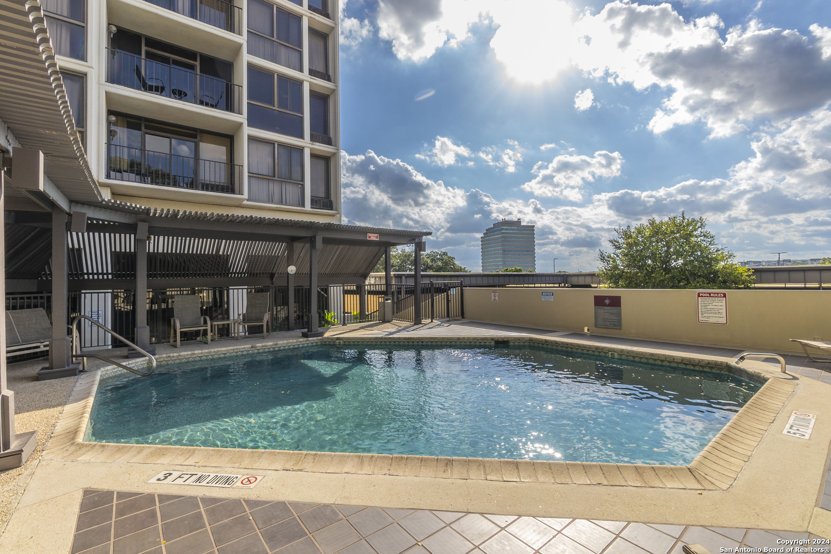 7701 Wurzbach Road, Unit 2302 San Antonio, TX 78229 - Photo 37 of 40 a view of a house with a swimming pool