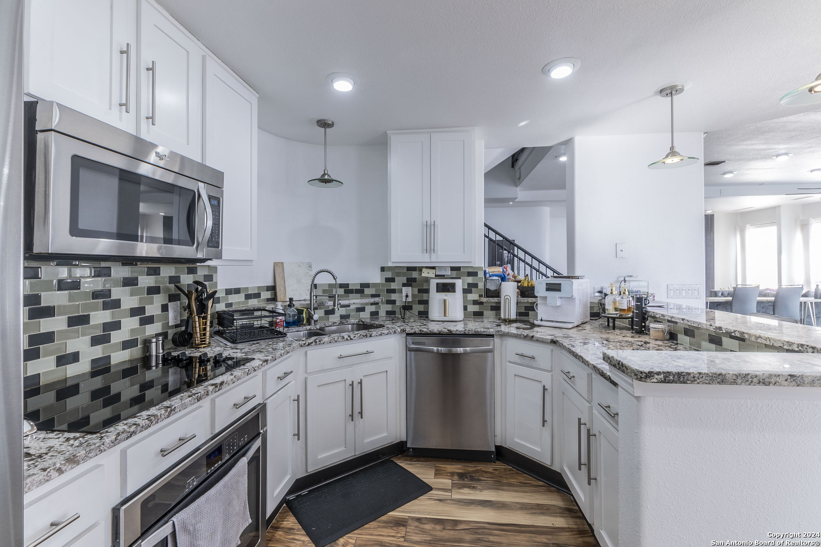 7701 Wurzbach Road, Unit 2302 San Antonio, TX 78229 - Photo 8 of 40 a kitchen with a sink stove and microwave