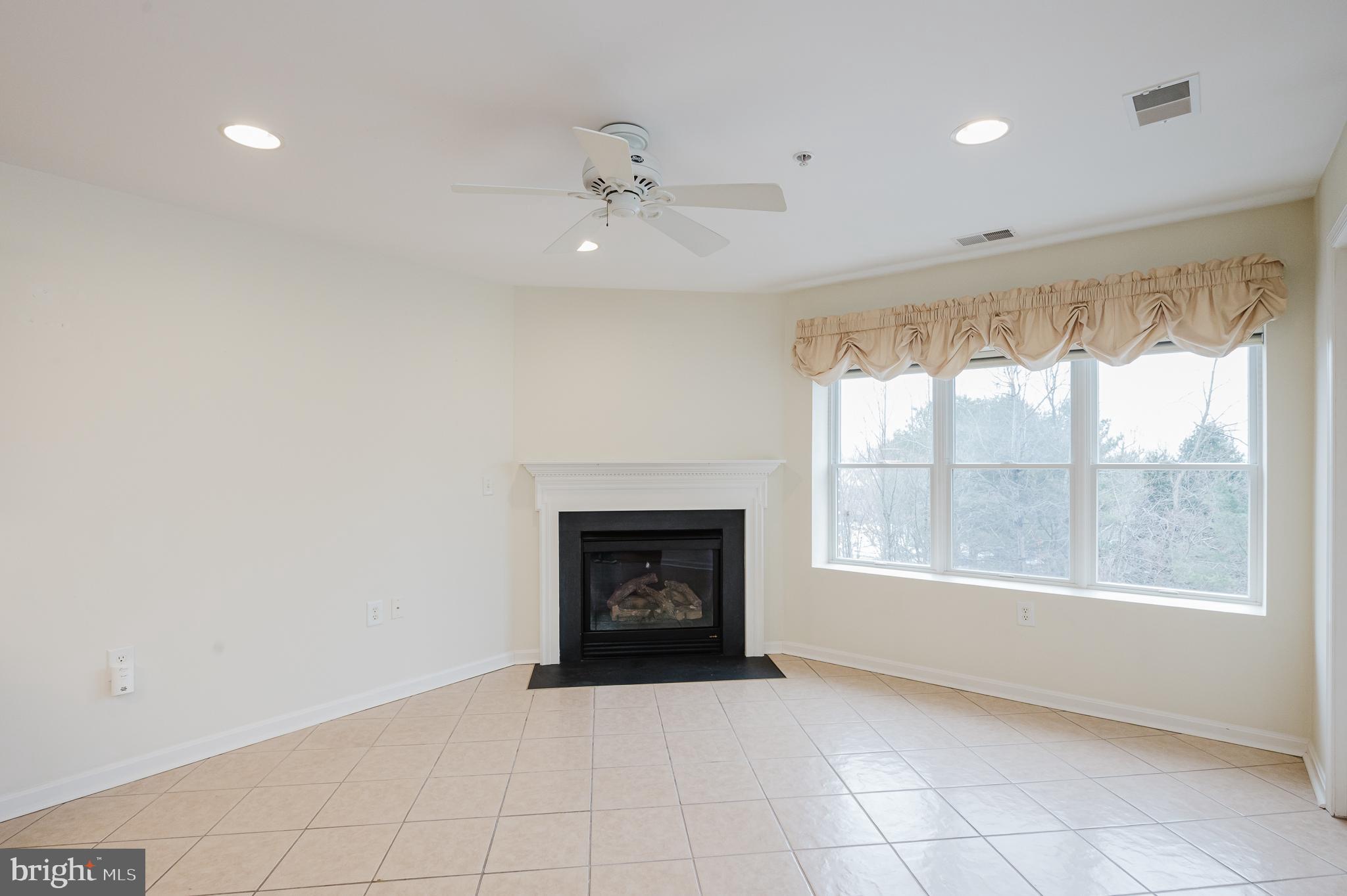 12240 Roundwood Road, Unit 405 Lutherville-Timonium, MD 21093 - Photo 19 of 51 RECESSED LIGHTING/ GAS FIREPLACE/ CEILING FAN