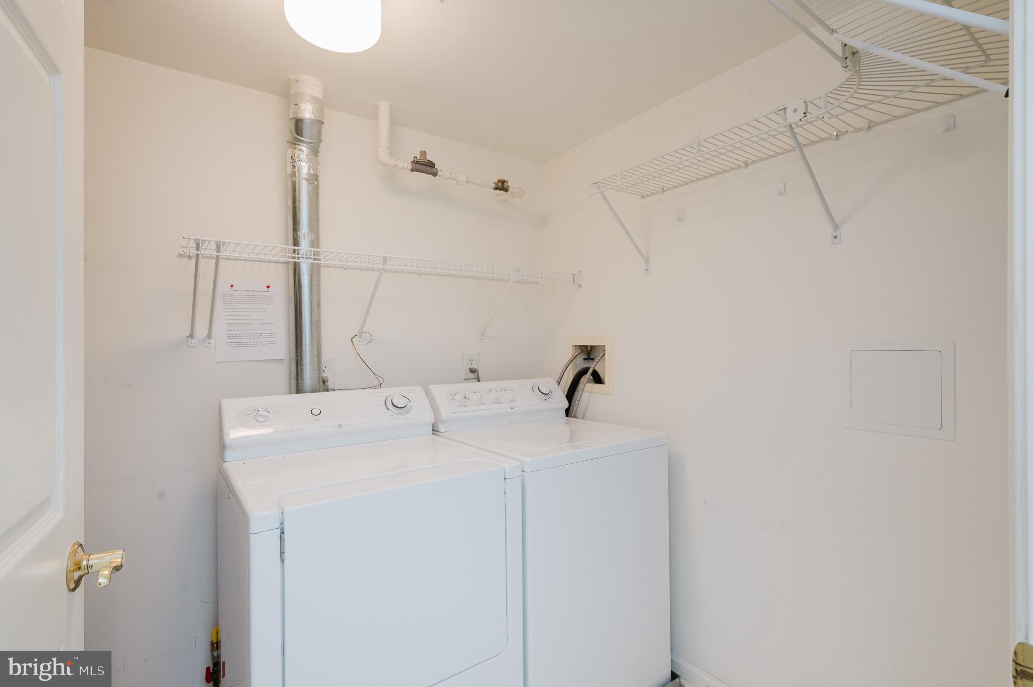12240 Roundwood Road, Unit 405 Lutherville-Timonium, MD 21093 - Photo 33 of 51 LAUNDRY ROOM WITH FULL SIZE WASHER DRYER