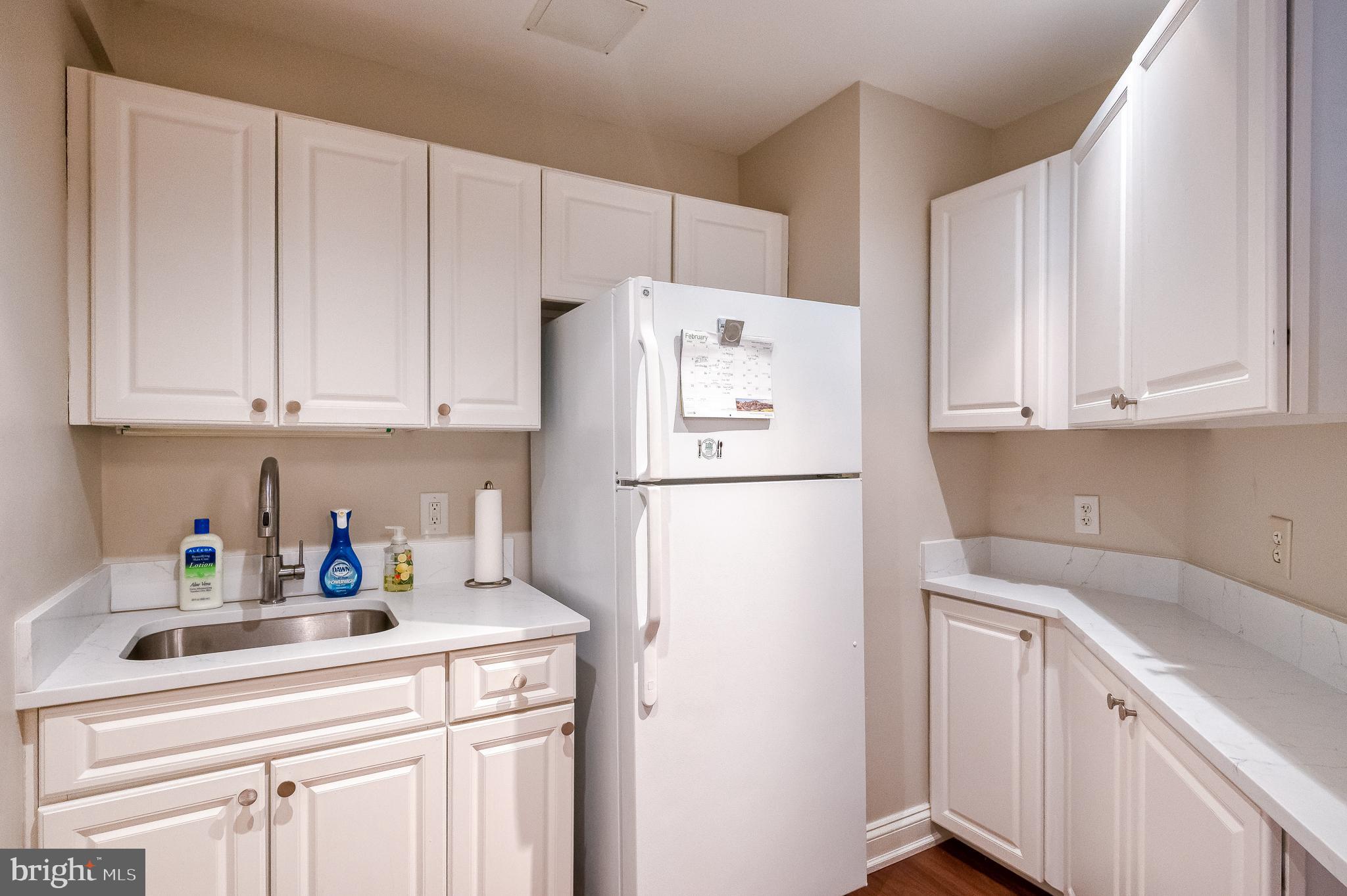 12240 Roundwood Road, Unit 405 Lutherville-Timonium, MD 21093 - Photo 43 of 51 CONVENIENT KITCHEN IN COMMUNITY ROOM
