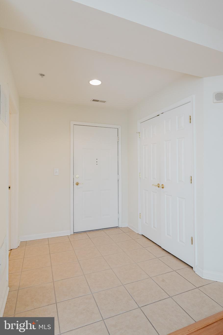 12240 Roundwood Road, Unit 405 Lutherville-Timonium, MD 21093 - Photo 6 of 51 ENTRANCE FOYER