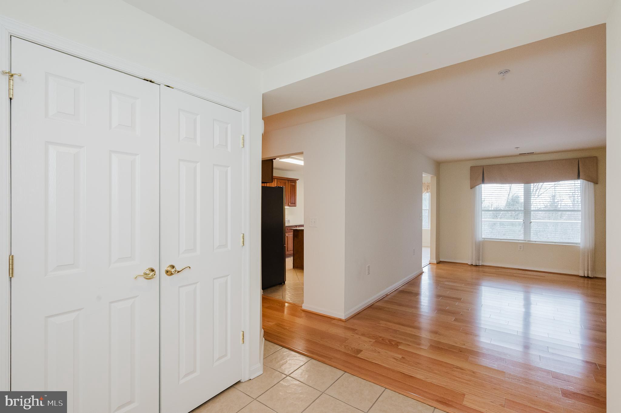 12240 Roundwood Road, Unit 405 Lutherville-Timonium, MD 21093 - Photo 7 of 51 FOYER INTO LIVING ROOM