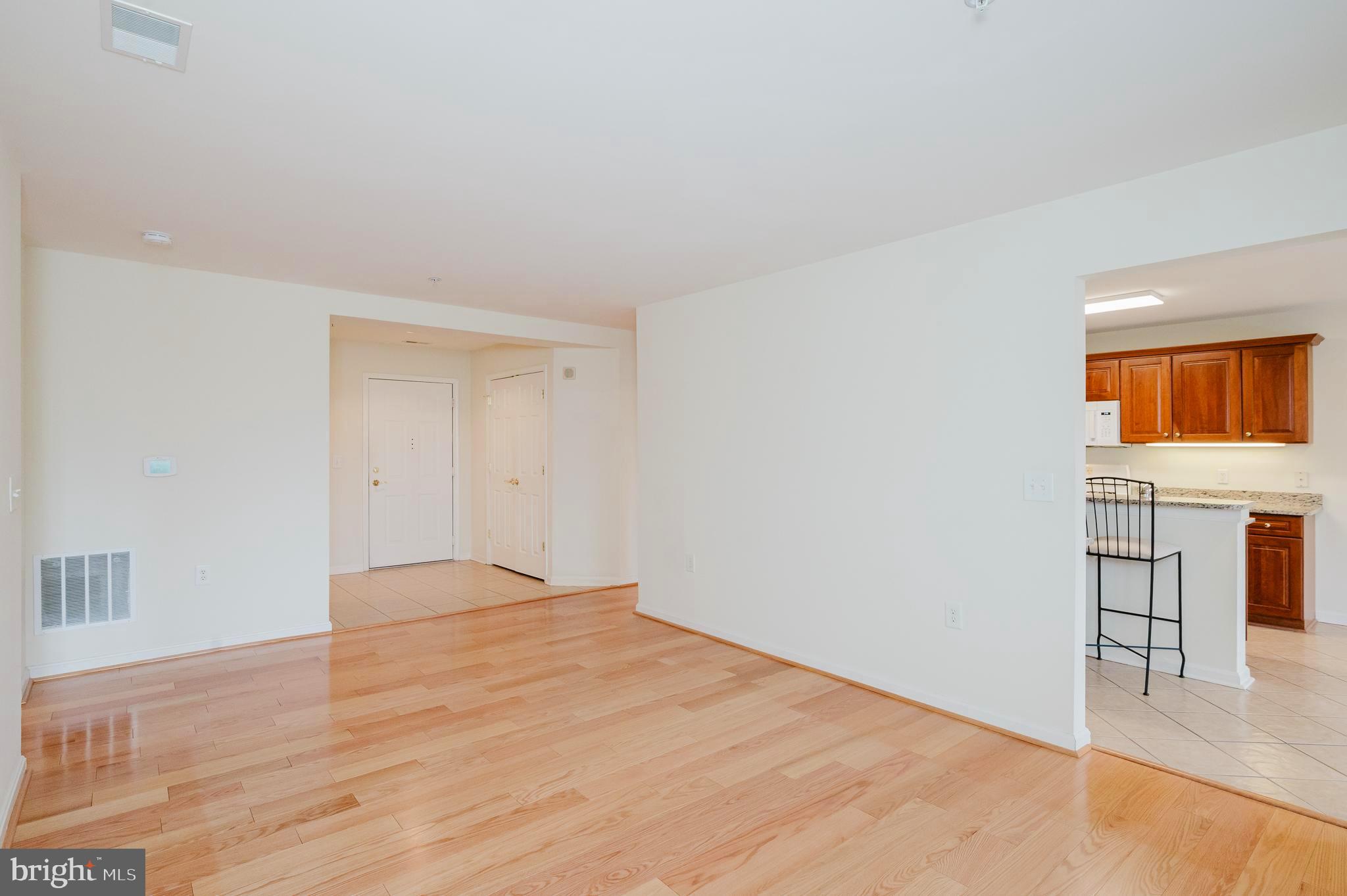 12240 Roundwood Road, Unit 405 Lutherville-Timonium, MD 21093 - Photo 8 of 51 LIVING ROOM WITH HARDWOOD FLOORING