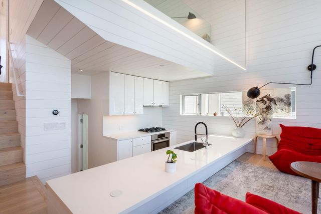 a kitchen that has a sink and a stove