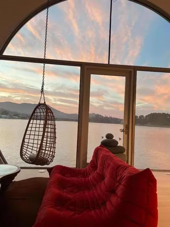 a bedroom with a bed and a painting on the wall