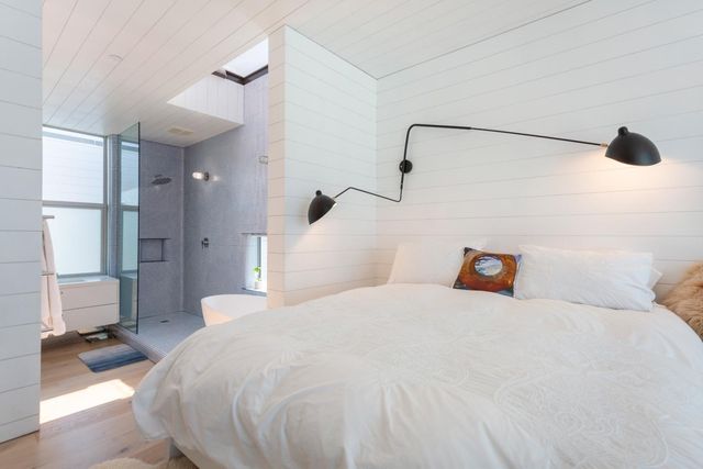 a bathroom with a bathtub and sink