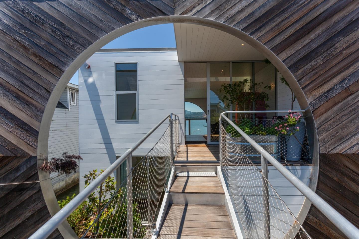 23 Gate 6 1/2 Road Sausalito, CA 94965 - Photo 5 of 34 a balcony with wooden floor and furniture