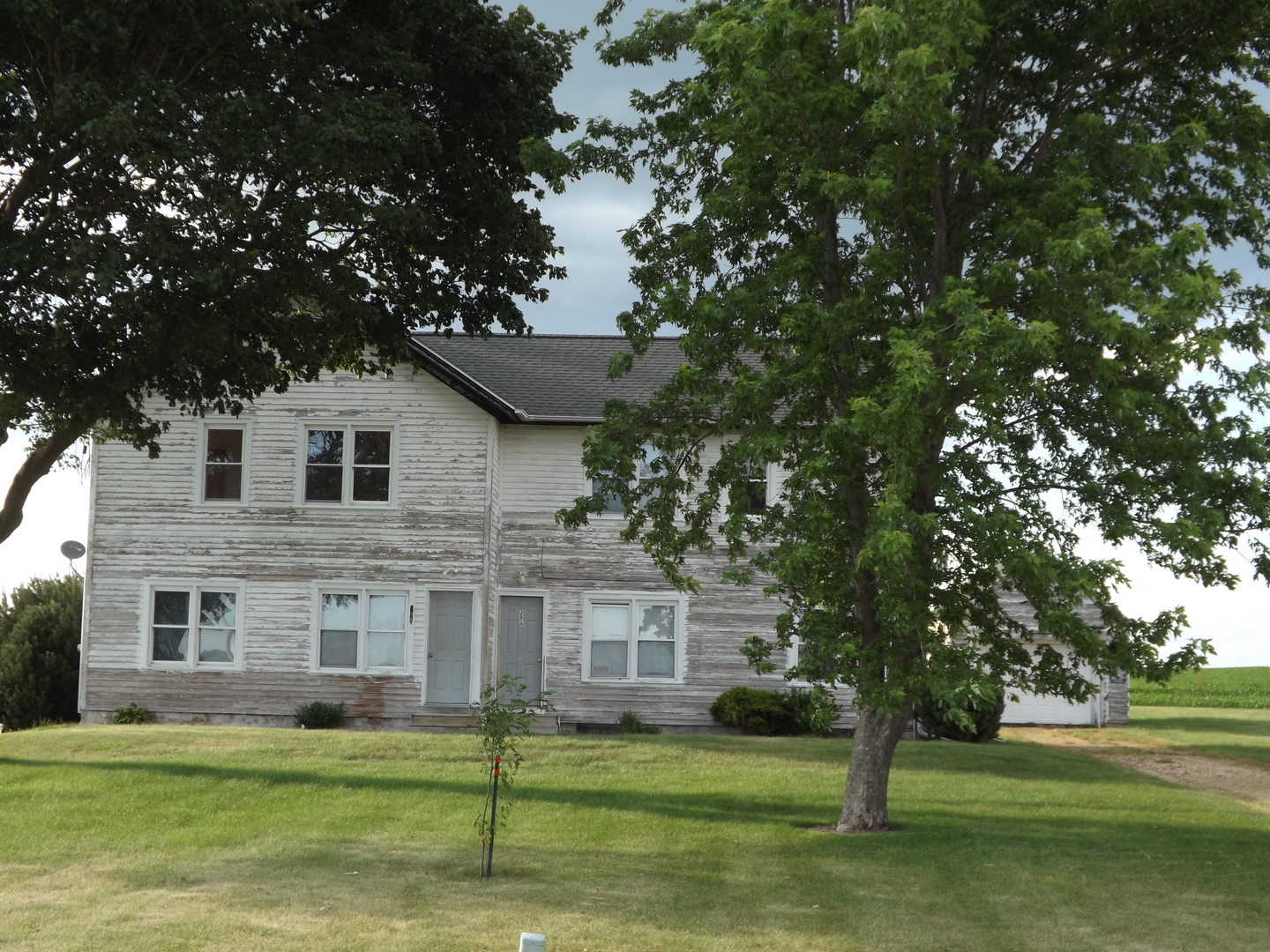 296 Timber Creek Road Dixon, IL 61021 - Photo 1 of 20 a front view of a house with a garden