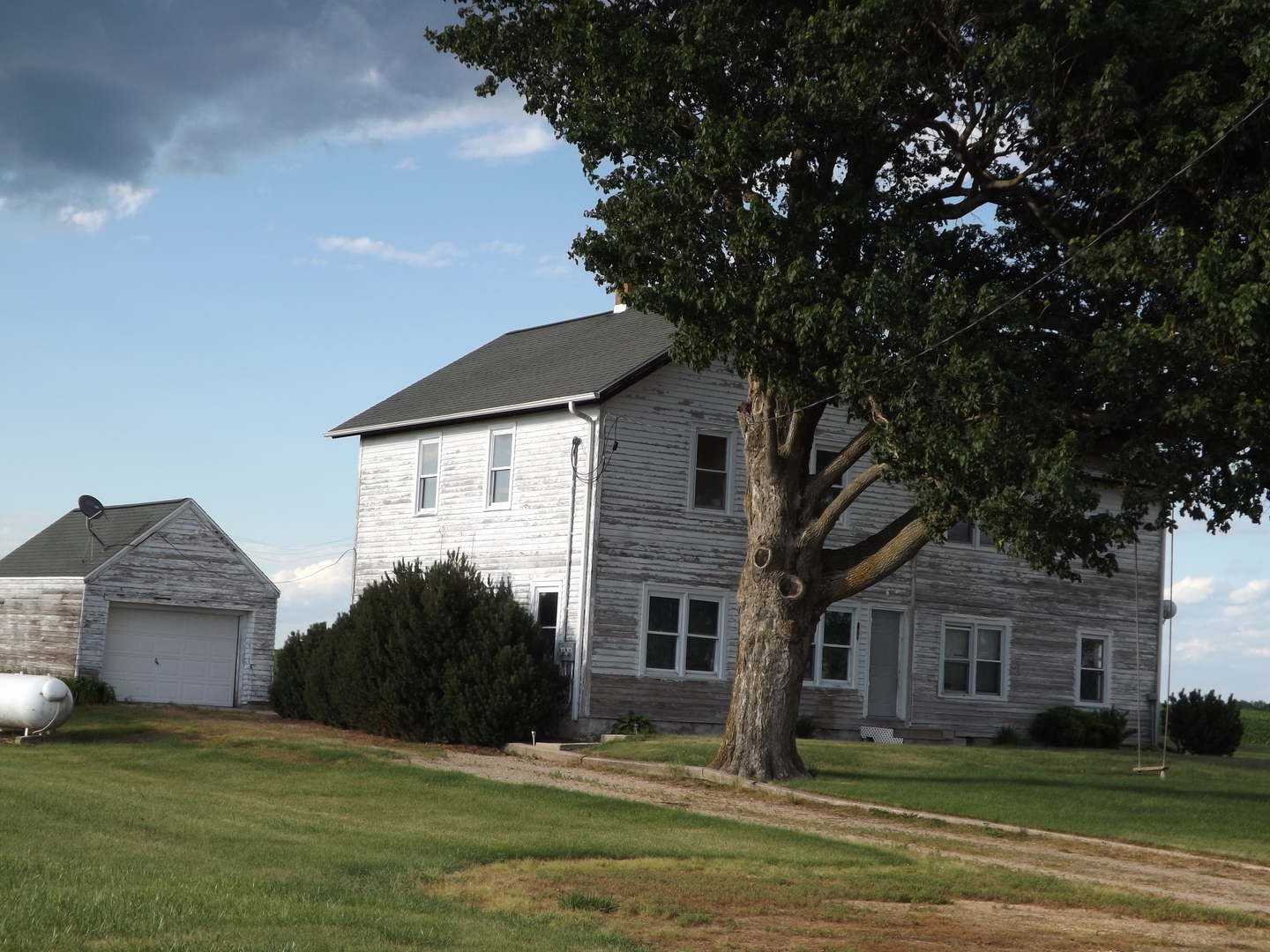296 Timber Creek Road Dixon, IL 61021 - Photo 2 of 20 a front view of a house with a garden and trees